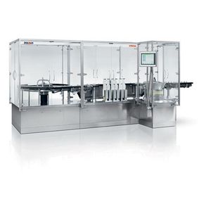 remplisseuse de liquide / à mouvement continu / en ligne / volumétrique