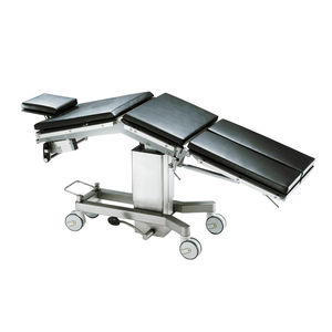 table d'opération universelle / hydraulique / à hauteur variable / sur roulettes