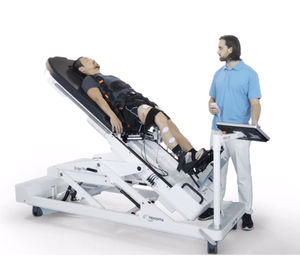 table de verticalisation électrique / sur roulettes / à hauteur variable / pour thérapie