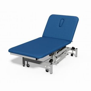 table d'examen électrique / à hauteur variable / sur roulettes / 2 sections