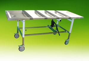 table d'embaumement sur roulettes / à hauteur variable / hydraulique