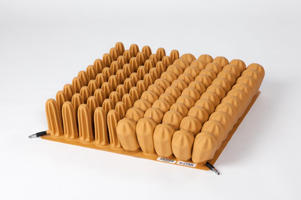 Coussin de protection Standard Contour Star Cushion Products pour fauteuil roulant