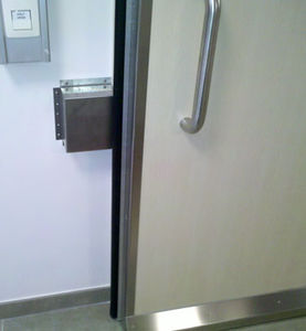 porte coulissante / pour service de radiologie / pour établissement de santé / double